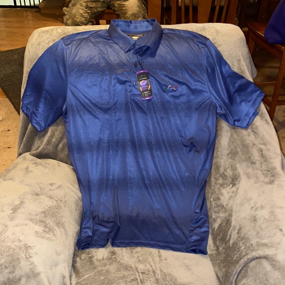 Greg Norman polo shirt, new with tags moisture wicking sun protection. Size-xxl.